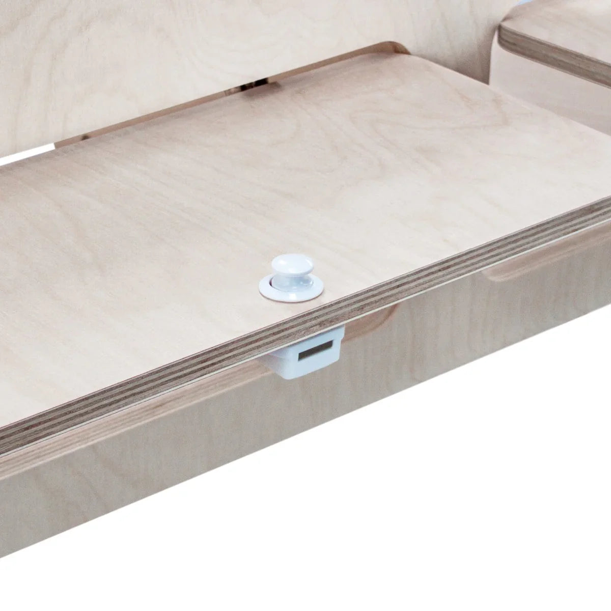 Light wood overhead camper cabinet with smooth surfaces, featuring a white knob and a sleek, minimalist design for efficient storage