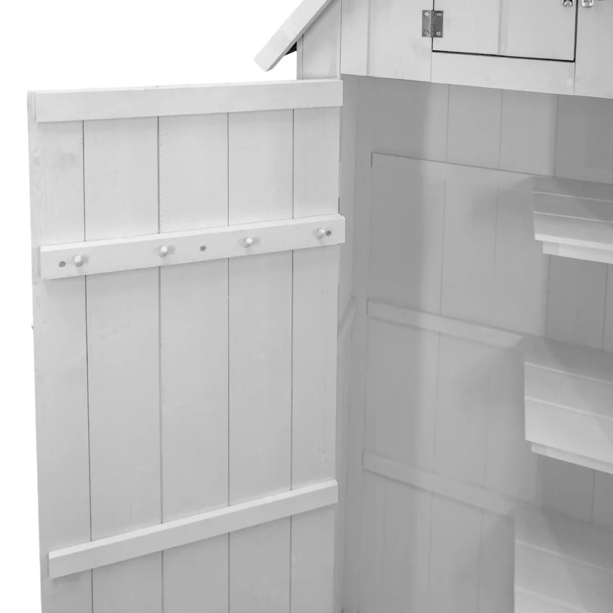 Interior view of a white wooden garden shed featuring shelves, hooks, and a clean, organized space for storage