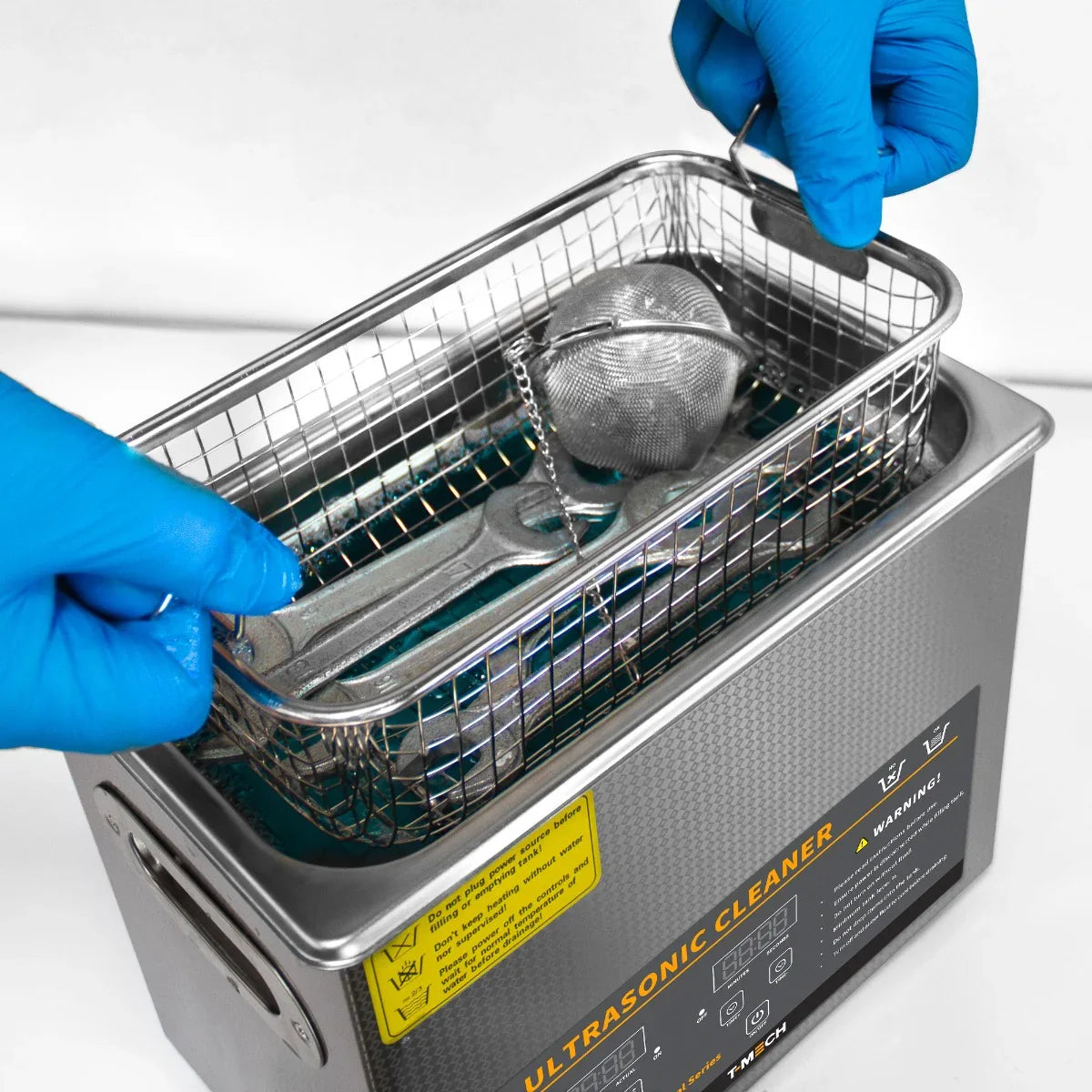 T-Mech Ultrasonic Cleaner 6L with stainless steel basket, blue gloves handling tools, showcasing sleek design and functionality