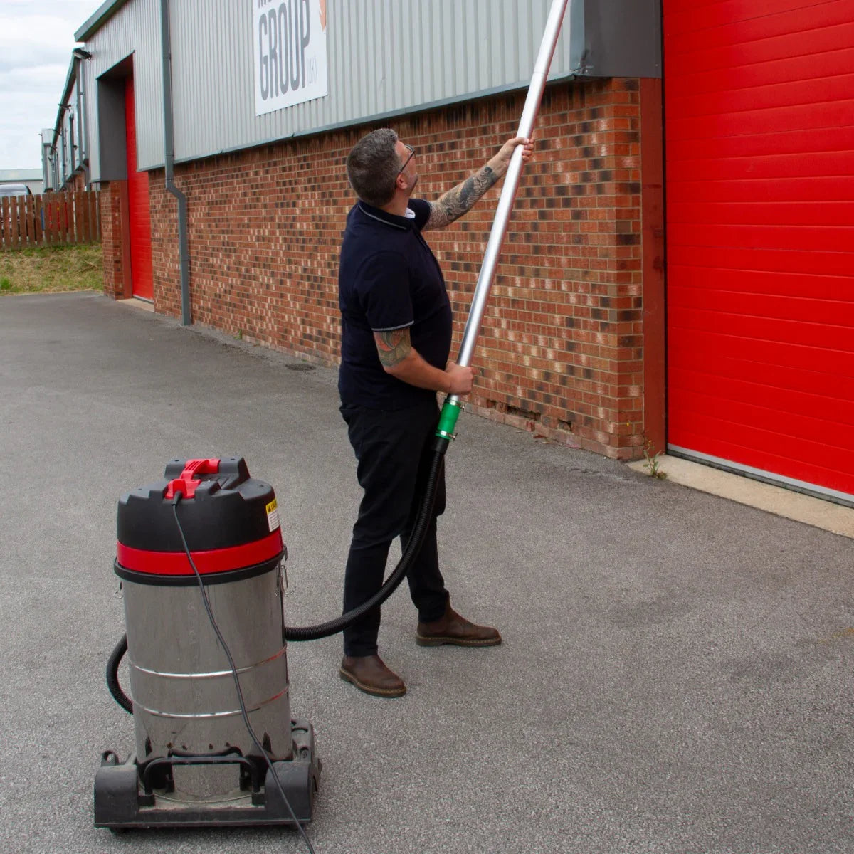 Maxblast Gutter Vacuum Poles 7.2m in use, featuring a sturdy pole and vacuum, ideal for cleaning high gutters efficiently
