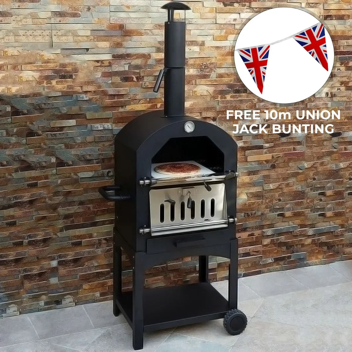 Outdoor pizza oven with a sleek black finish, a stainless steel door, and a pizza peel, accompanied by Union Jack bunting for festive occasions