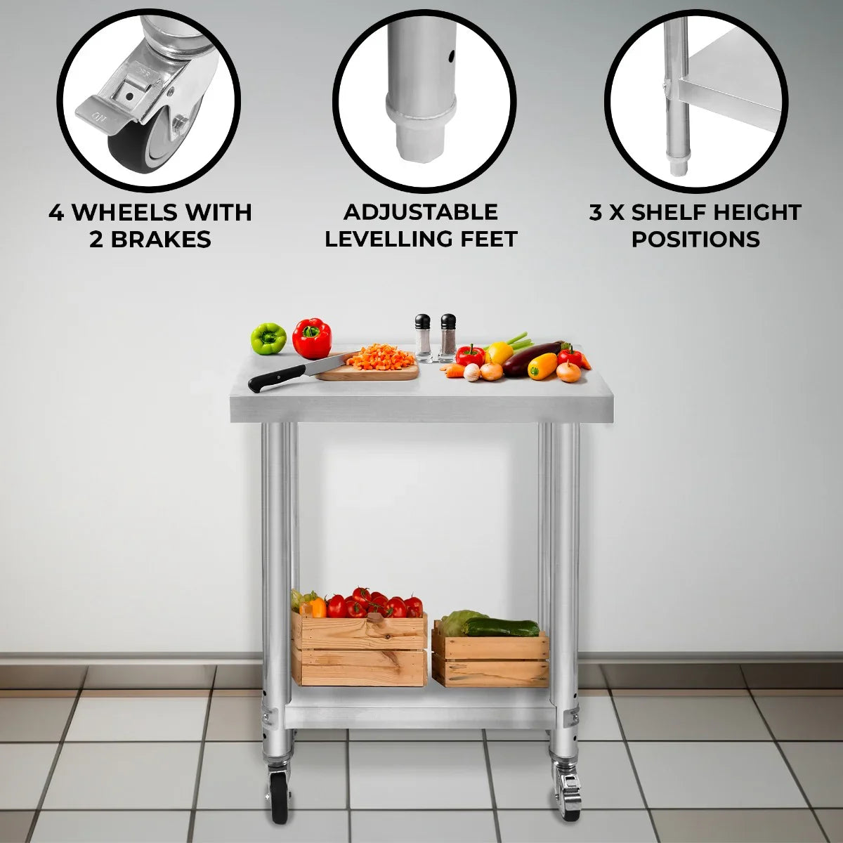 KuKoo Work Table in stainless steel with adjustable height, four wheels, and two brakes, featuring fresh vegetables and storage baskets