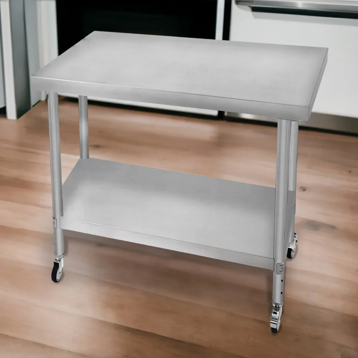 Stainless steel KuKoo work table with a smooth surface, sturdy legs, and a lower shelf, ideal for kitchens or workshops