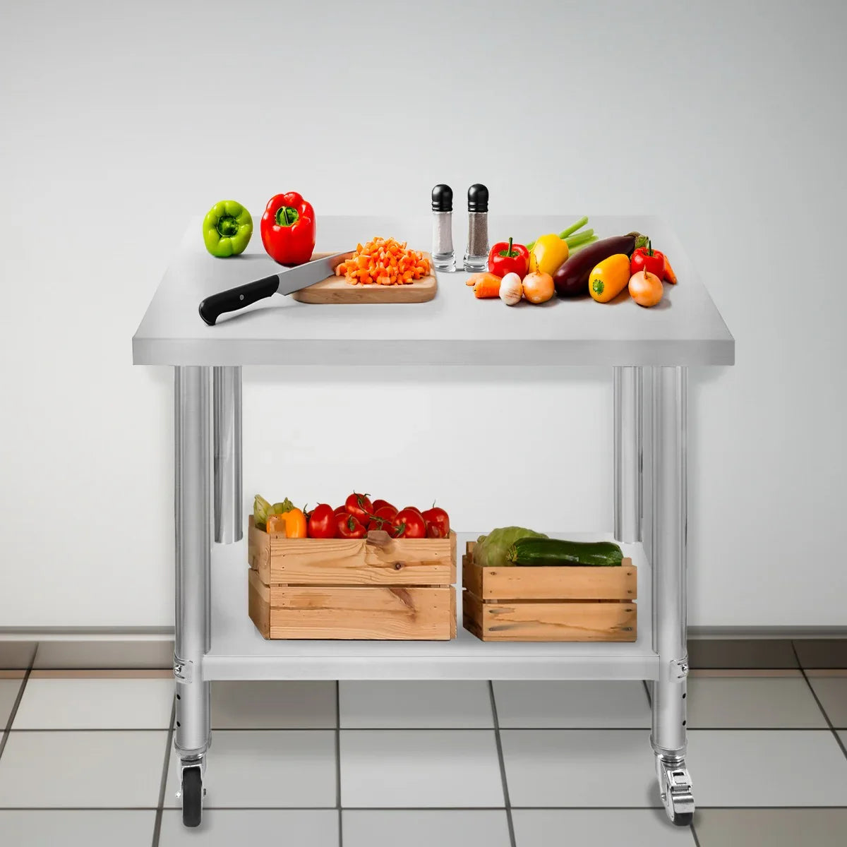 KuKoo Work Table with stainless steel top, featuring fresh vegetables, a chopping board, and storage crates on wheels
