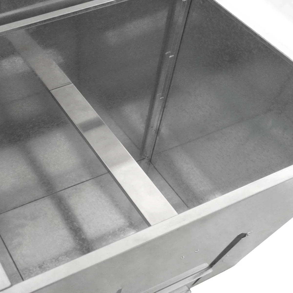 Galvanised coal bunker interior showing a spacious, rust-resistant metal design with a central divider for organized storage