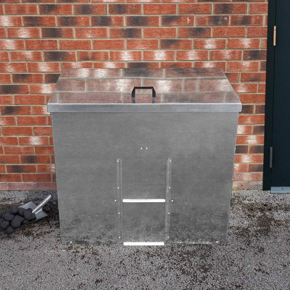 Galvanised coal bunker with a sleek silver finish, featuring a sturdy lid, handle, and ventilation slots, ideal for outdoor use
