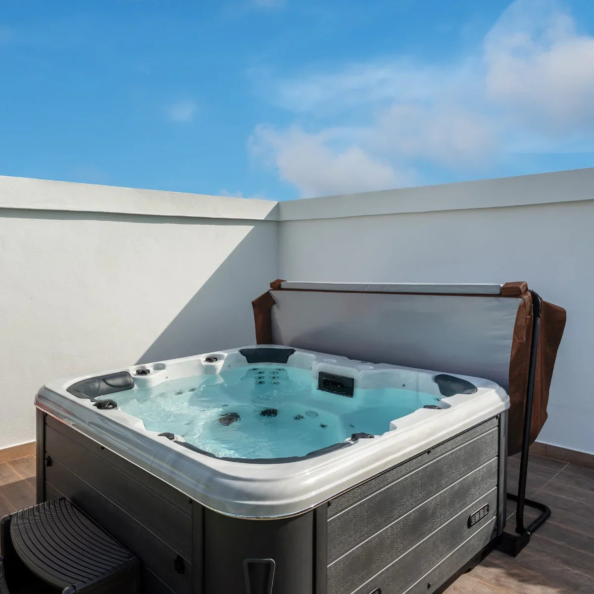 Brown 2.1m hot tub spa cover on a rooftop patio, featuring a sleek design and a protective, water-resistant material
