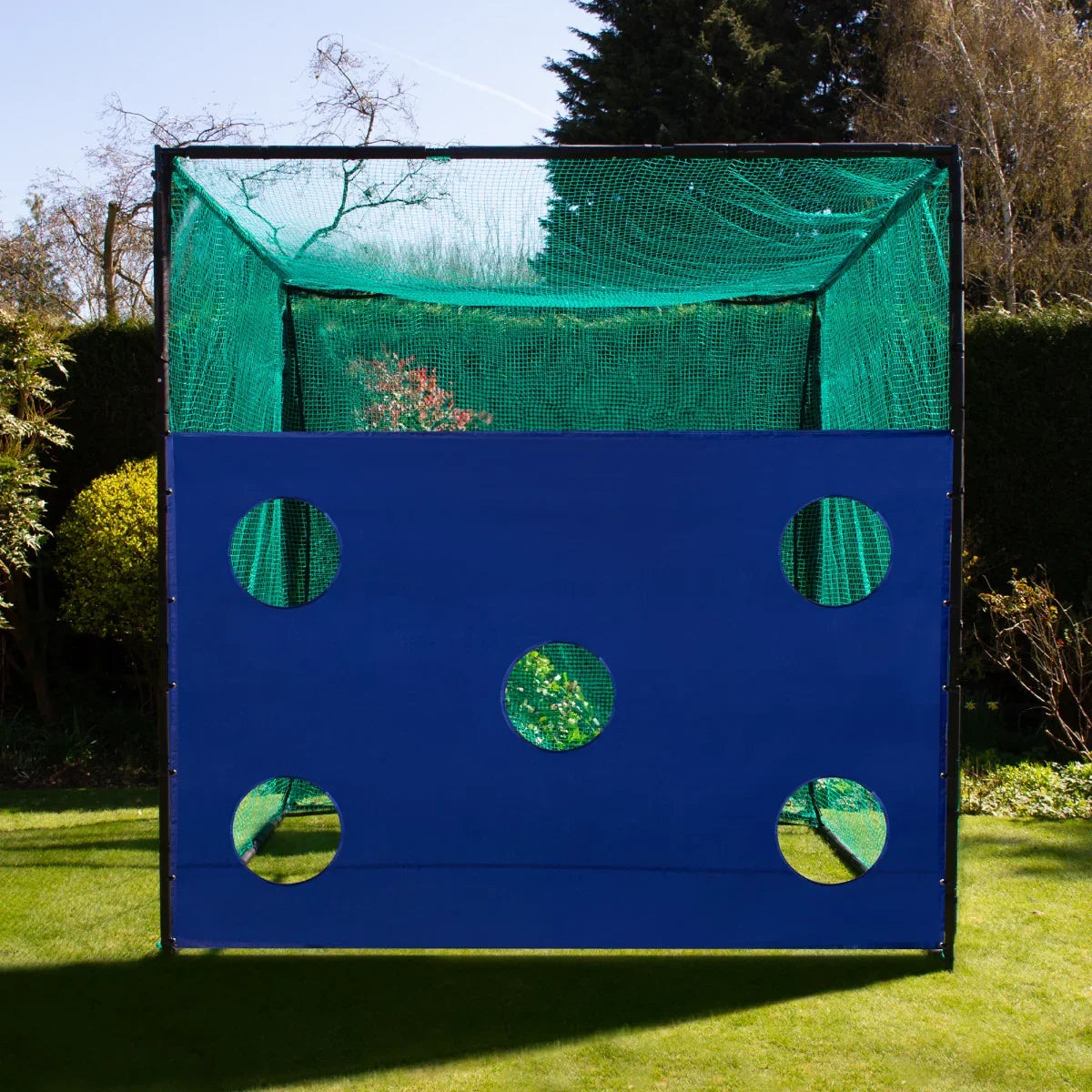 Golf practice cage with a vibrant green netting and a blue target sheet featuring circular holes for accurate shot practice