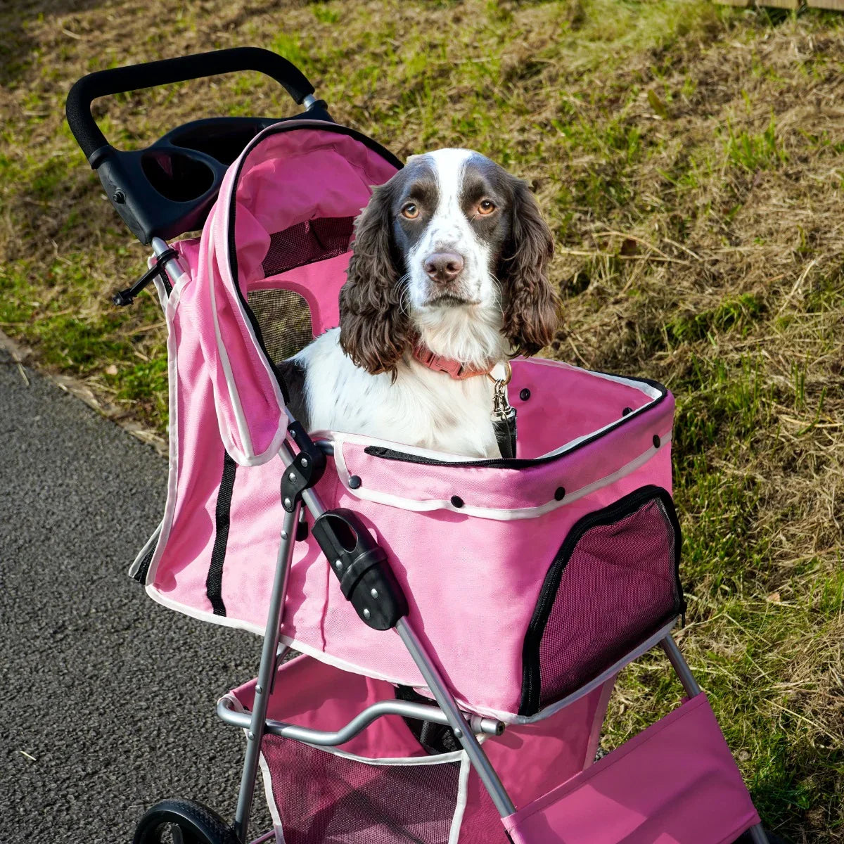 Pink pet stroller with rain cover, featuring a cozy interior and a happy dog sitting comfortably inside on a sunny day