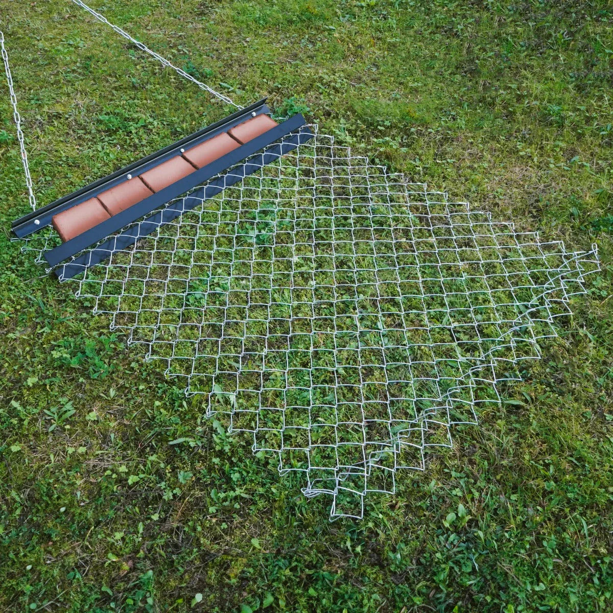 Durable chain drag harrow measuring 1.5m x 1.2m, featuring a sturdy metal frame and a diamond mesh design for effective soil leveling