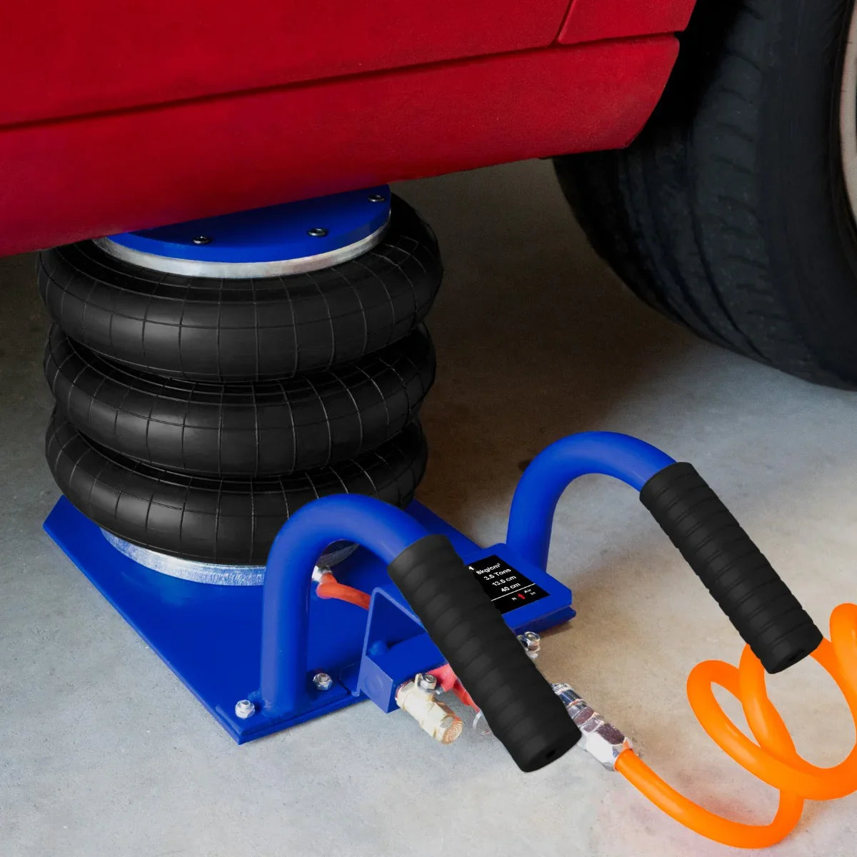 Air Bag Jack 3.5T with durable black rubber bags, blue carrying handle, and connected air hose, positioned under a vehicle