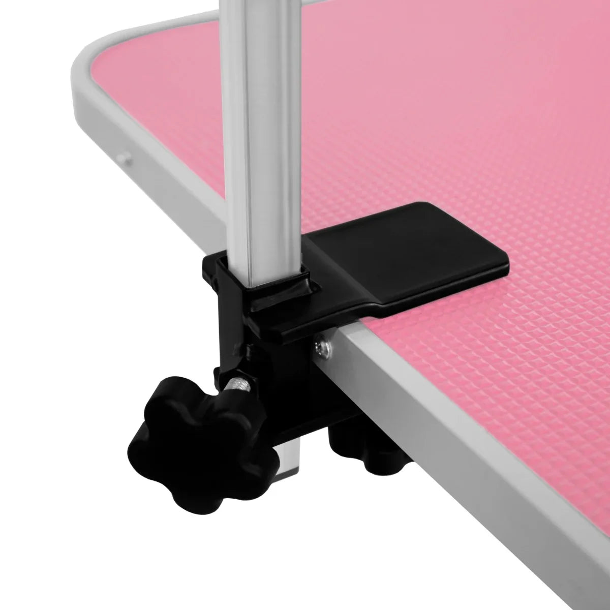 White hydraulic grooming table with a textured pink top, featuring a sturdy black clamp for height adjustment and stability