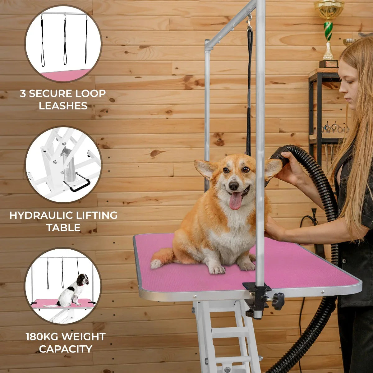 White hydraulic grooming table with a pink top, featuring three secure loop leashes, ideal for pet grooming and a 180kg weight capacity
