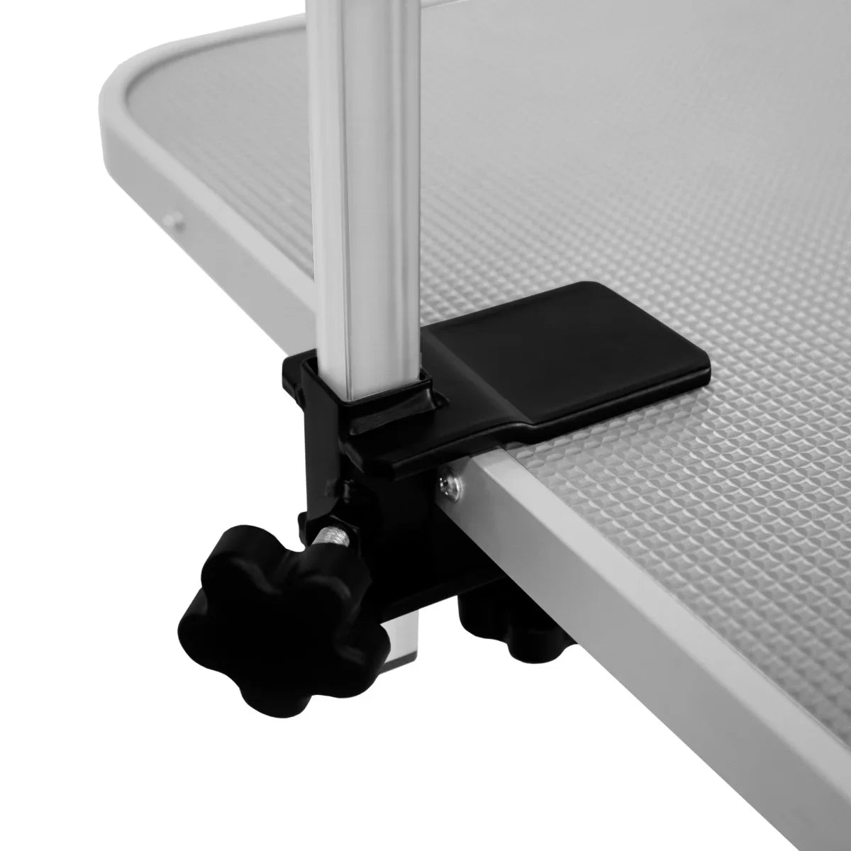 Close-up of the adjustable clamp on a white hydraulic grooming table with a textured grey tabletop, showcasing sturdy construction