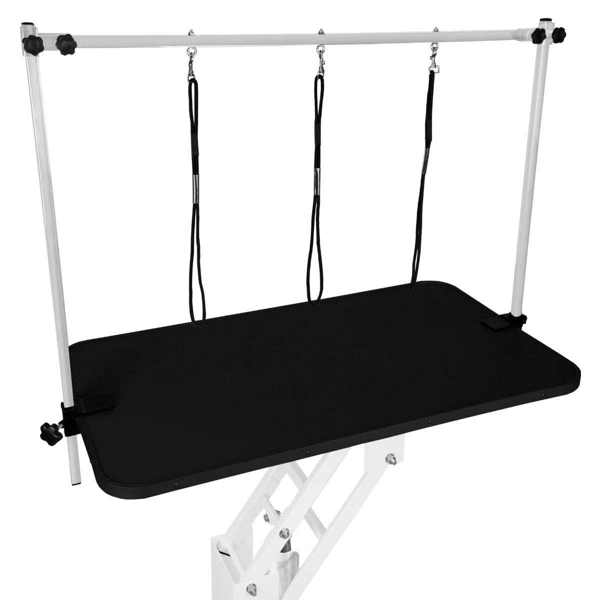 White hydraulic grooming table with a black textured tabletop, adjustable height, and three overhead grooming loops for secure pet handling