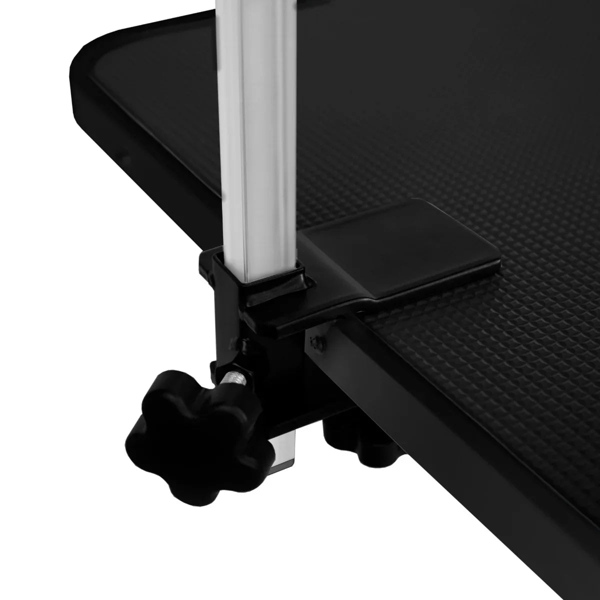 Black hydraulic grooming table featuring a textured black tabletop and sturdy adjustable legs for stability and convenience