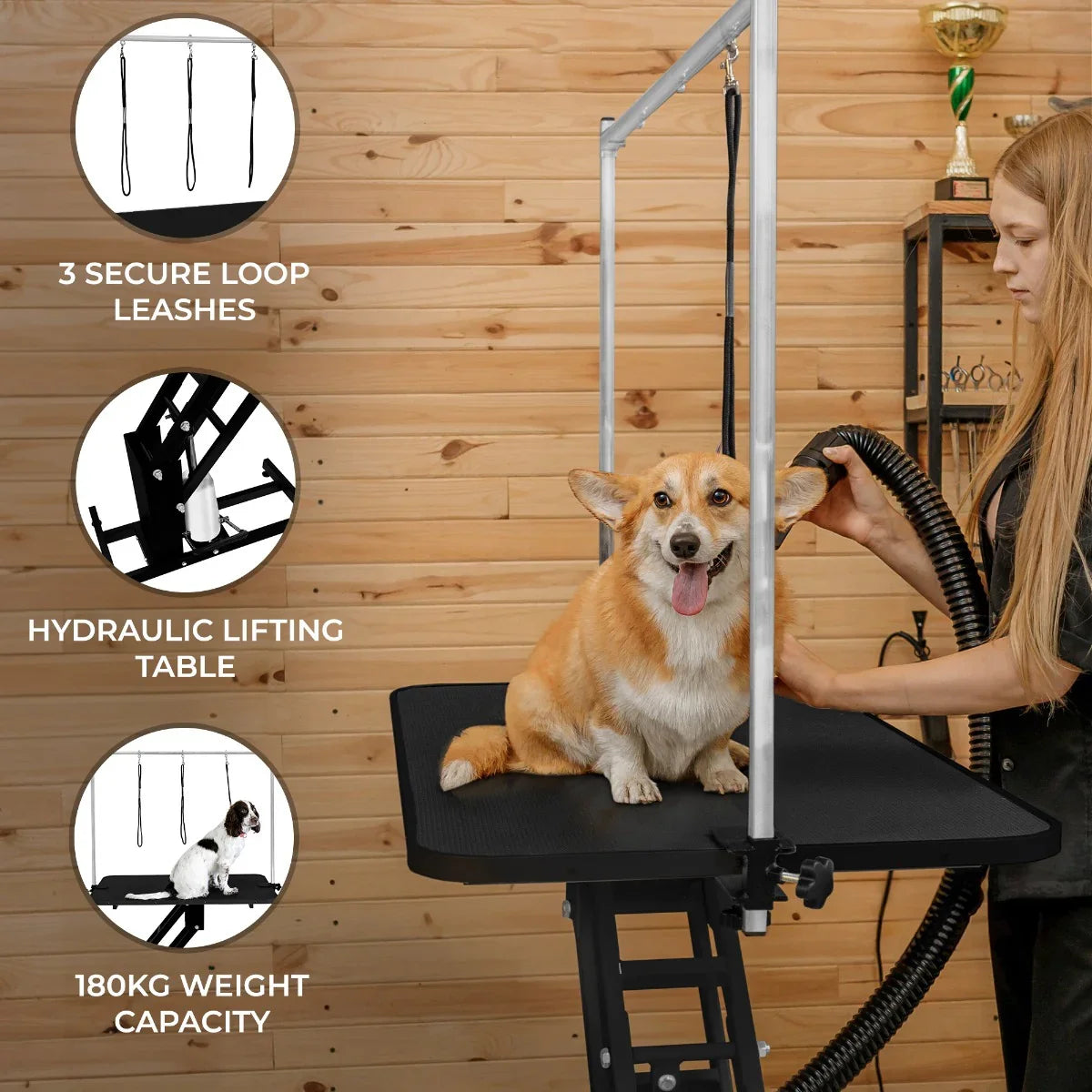 Black hydraulic grooming table with a textured black top, featuring three secure loop leashes and a 180kg weight capacity, ideal for pet grooming