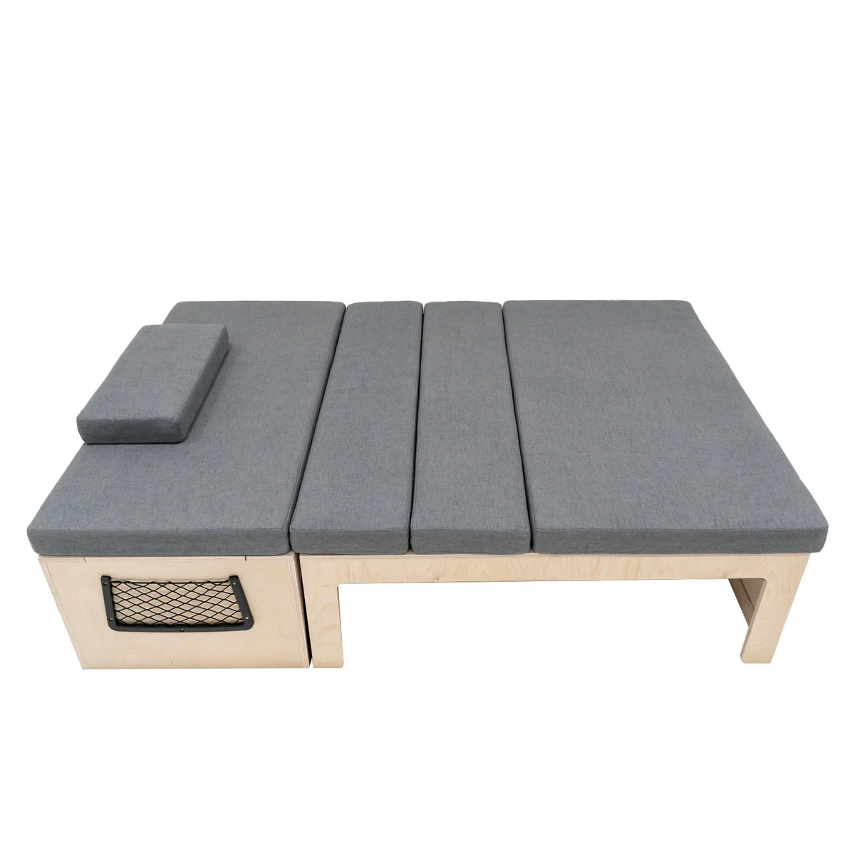 L-shaped camper van bed with gray fabric cushions, wooden frame, and a storage compartment, ideal for maximizing space and comfort