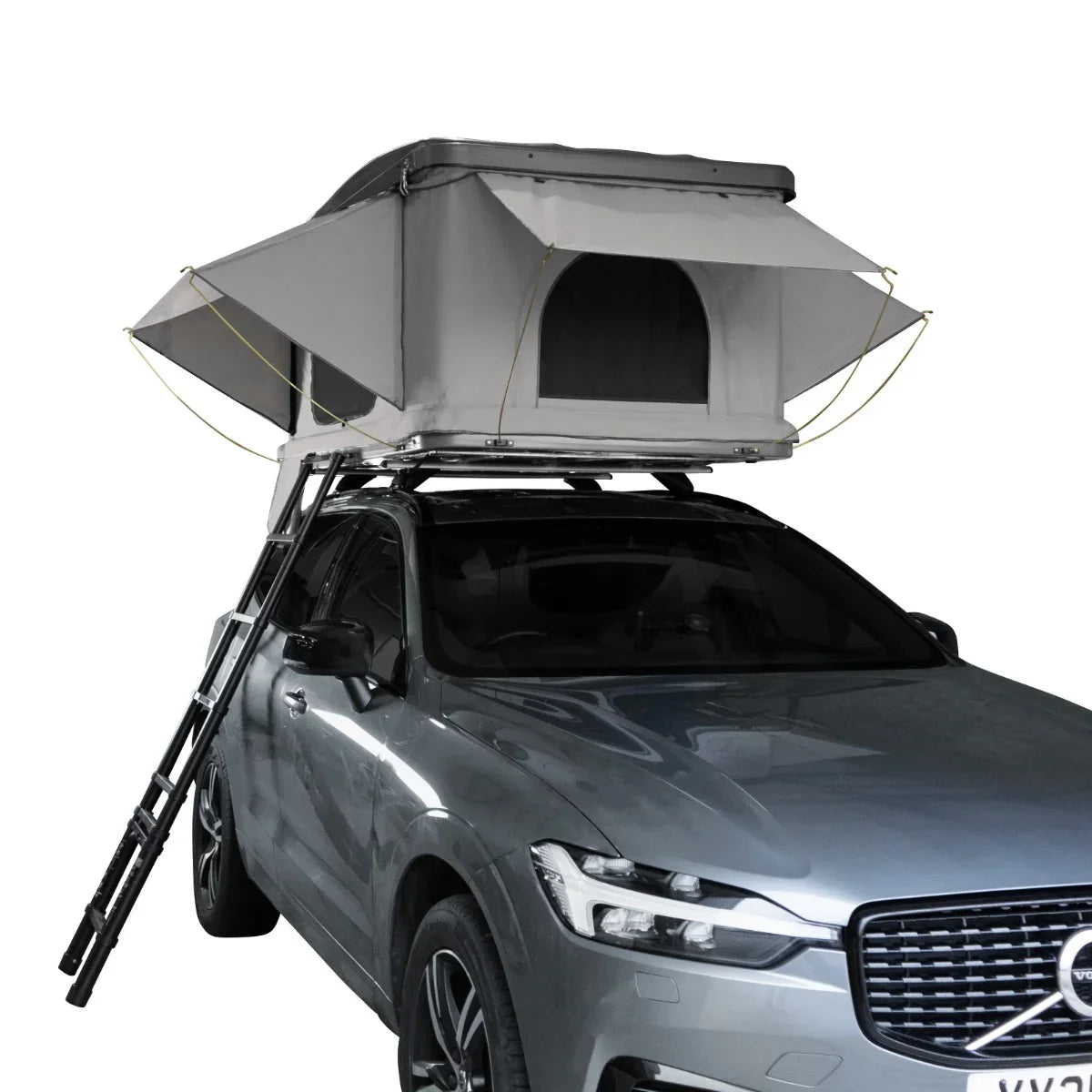 Grey car roof tent with a spacious design, mounted on a silver SUV, featuring a sturdy ladder for easy access and ventilation openings