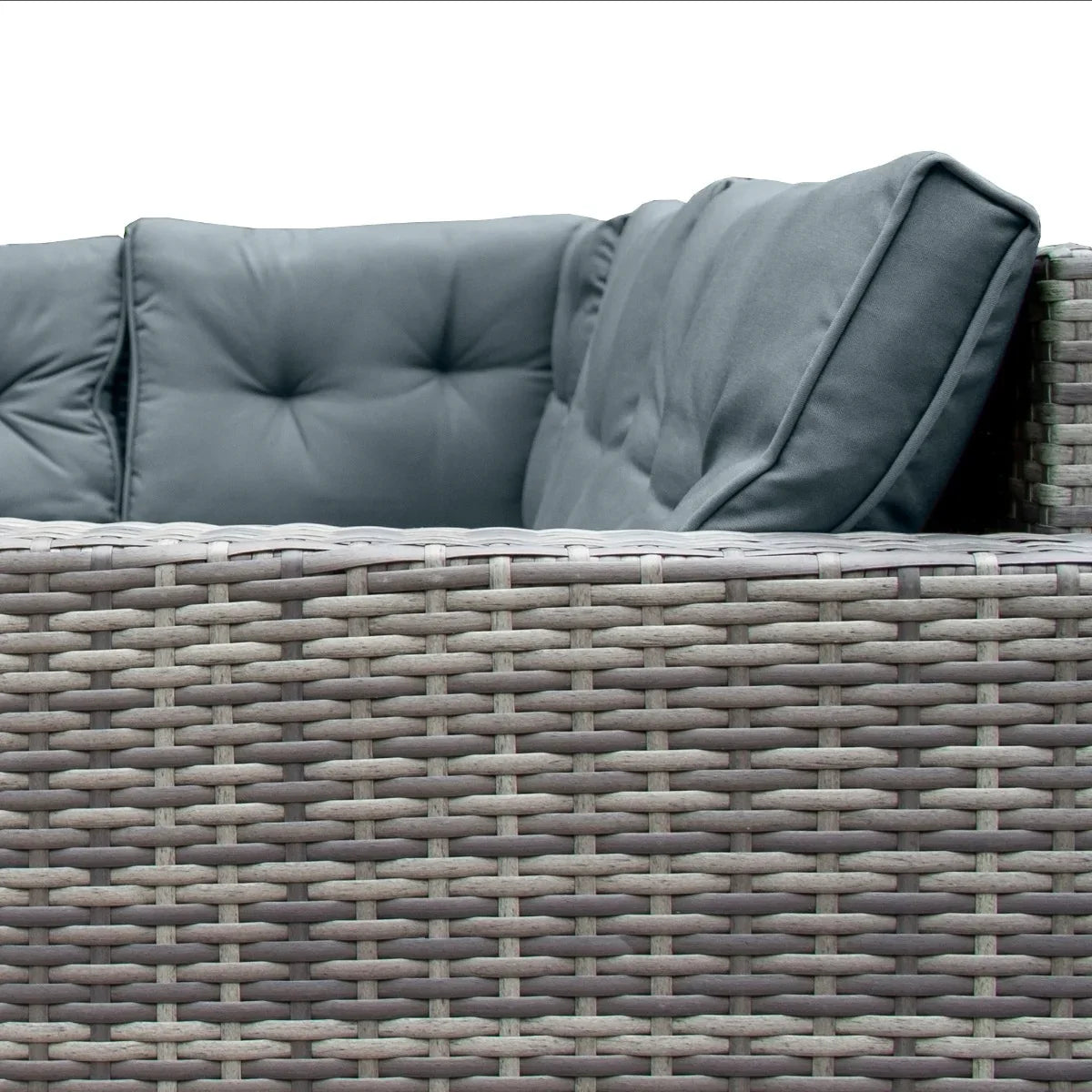 Grey rattan corner set featuring plush cushions, showcasing a textured weave and sturdy design, perfect for outdoor relaxation