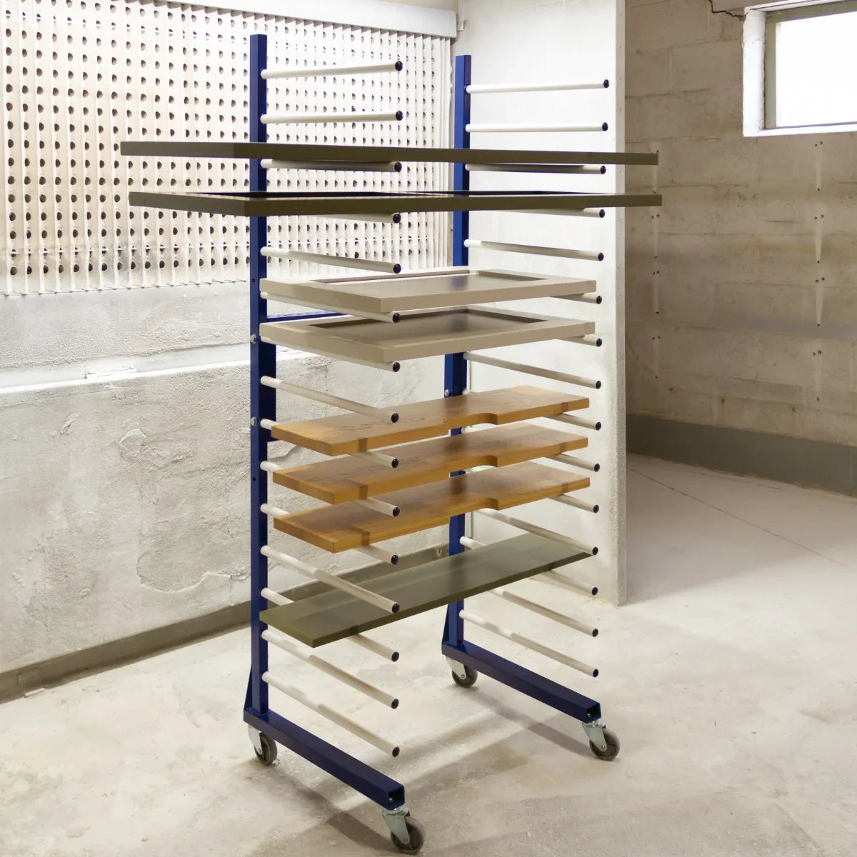 Combi Spray Drying Rack Trolley with multiple shelves, featuring a sturdy blue frame and wooden and glass surfaces for drying items