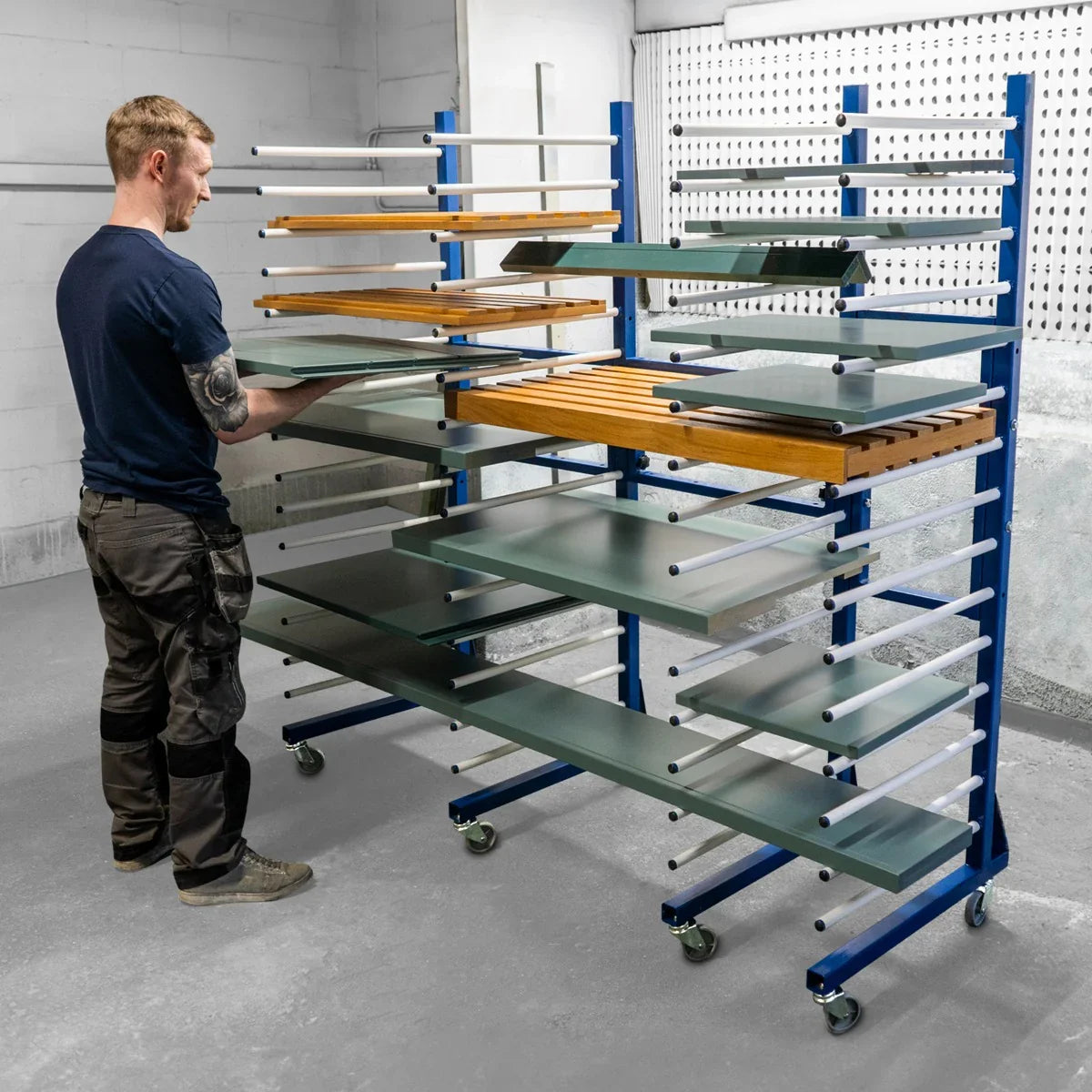 Combi Spray Drying Rack Trolley with four shelves, featuring wooden and green surfaces, sturdy blue frame, and rolling wheels for mobility