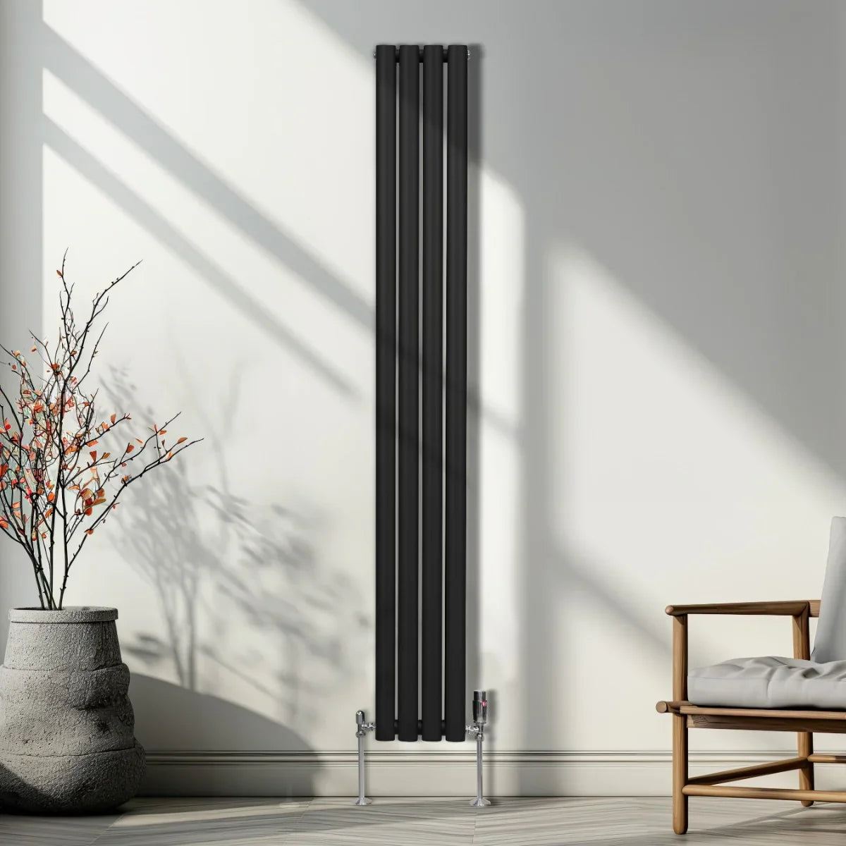 Sleek black oval column radiator standing tall in a modern room, featuring vertical bars and polished chrome feet, enhancing decor