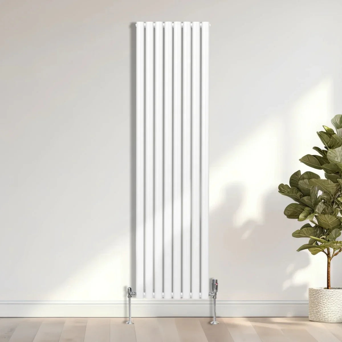 Sleek white oval column radiator, 1800mm x 480mm, featuring vertical bars and a modern design, set against a light wall and floor