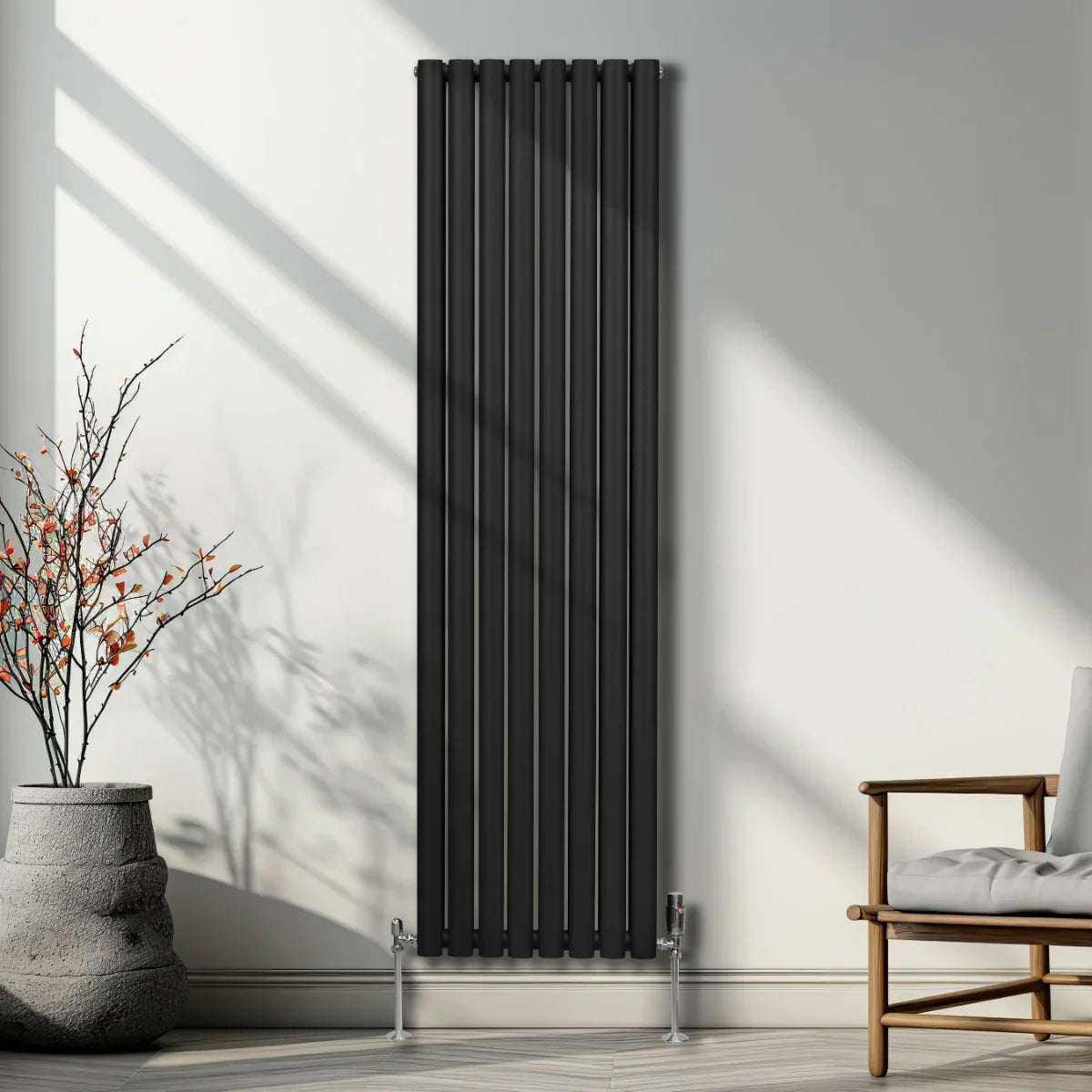 Sleek black oval column radiator, 1800mm x 480mm, featuring vertical lines and a modern design, enhancing a stylish interior space