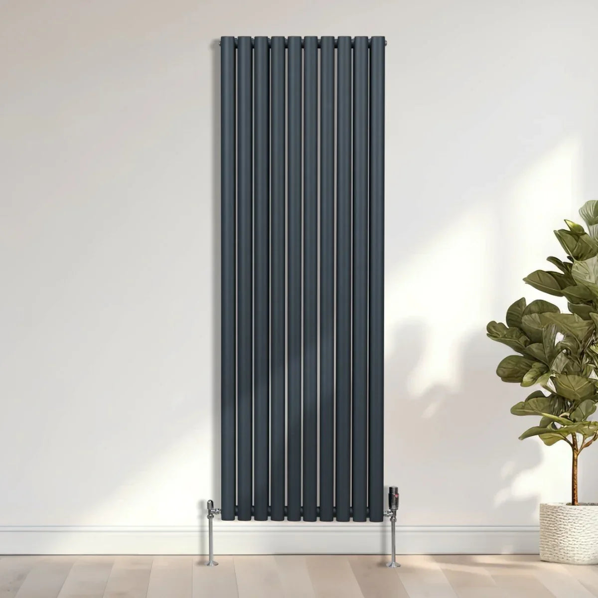 Oval column radiator in anthracite grey, 1800mm x 600mm, featuring sleek vertical lines and a modern design, mounted on the wall