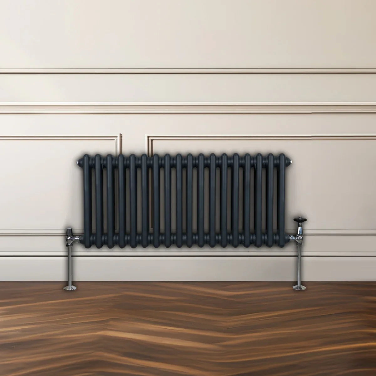 Traditional 2 column radiator in anthracite grey, featuring sleek vertical bars and polished chrome valves, set against a neutral wall