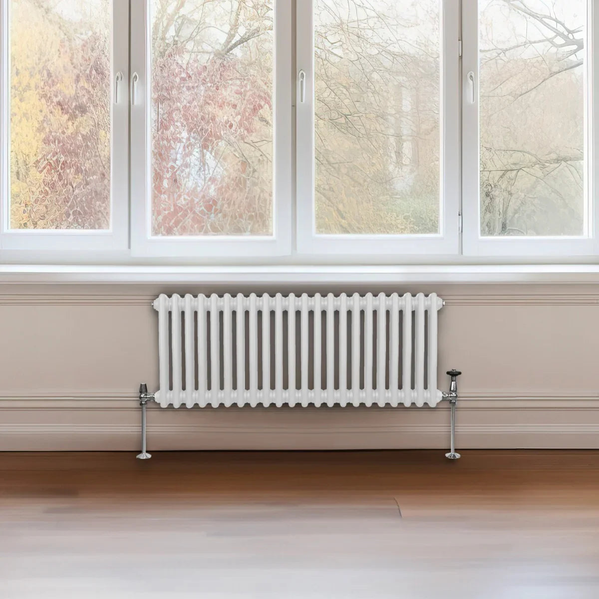 Traditional white 2 column radiator, 300 x 1012mm, featuring a sleek design with vertical bars, installed beneath a large window