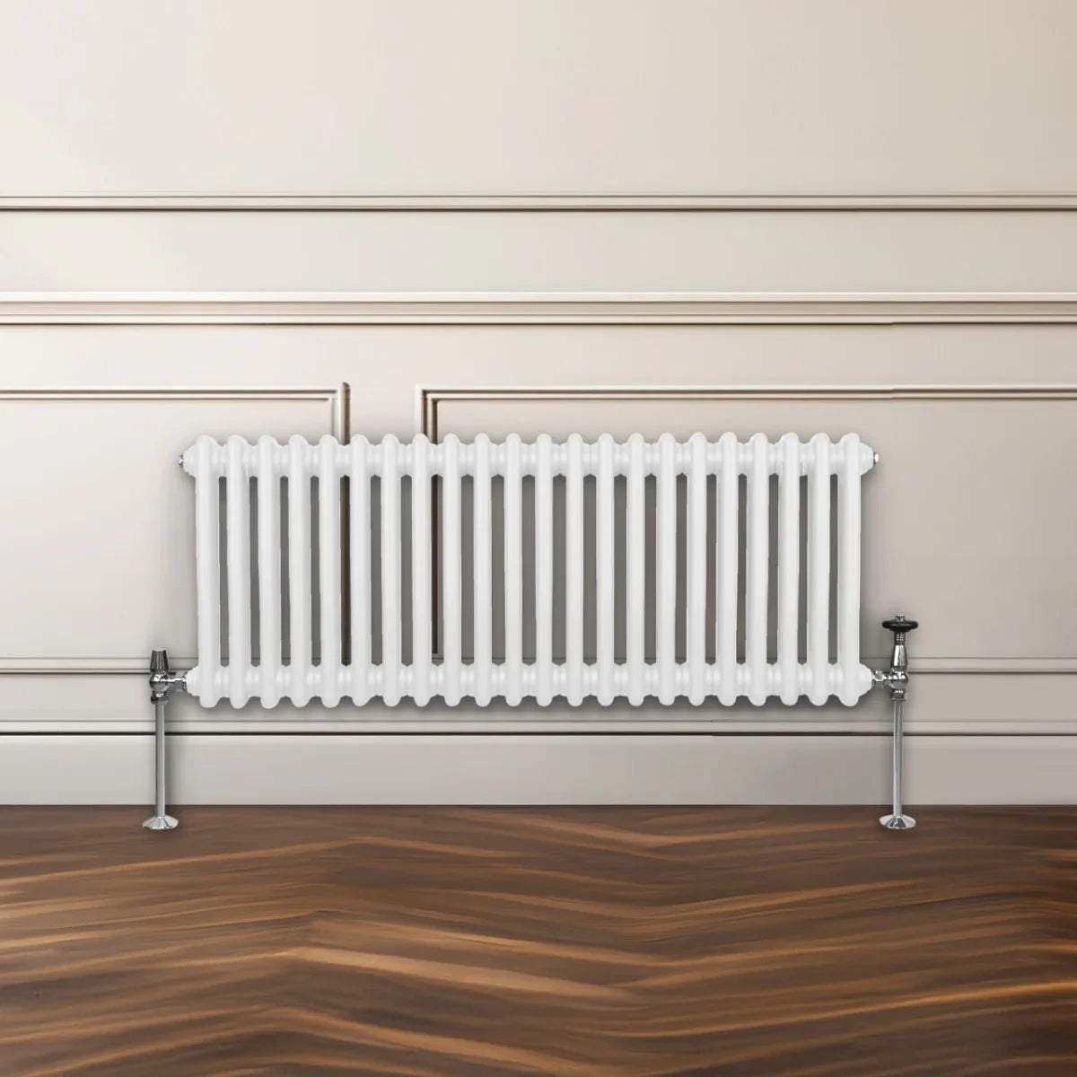 Traditional white 2 column radiator with a sleek design, featuring vertical fins and chrome feet, set against a neutral wall and wooden floor