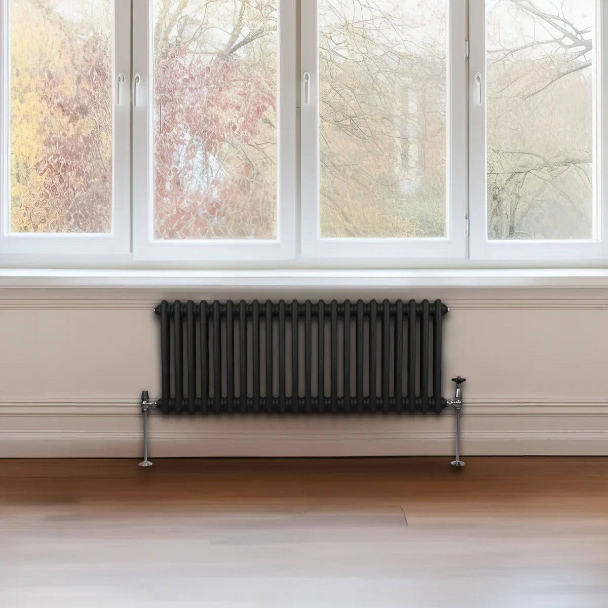 Traditional black 2 column radiator, 300 x 1012mm, featuring a sleek design with smooth, glossy finish, positioned under a large window