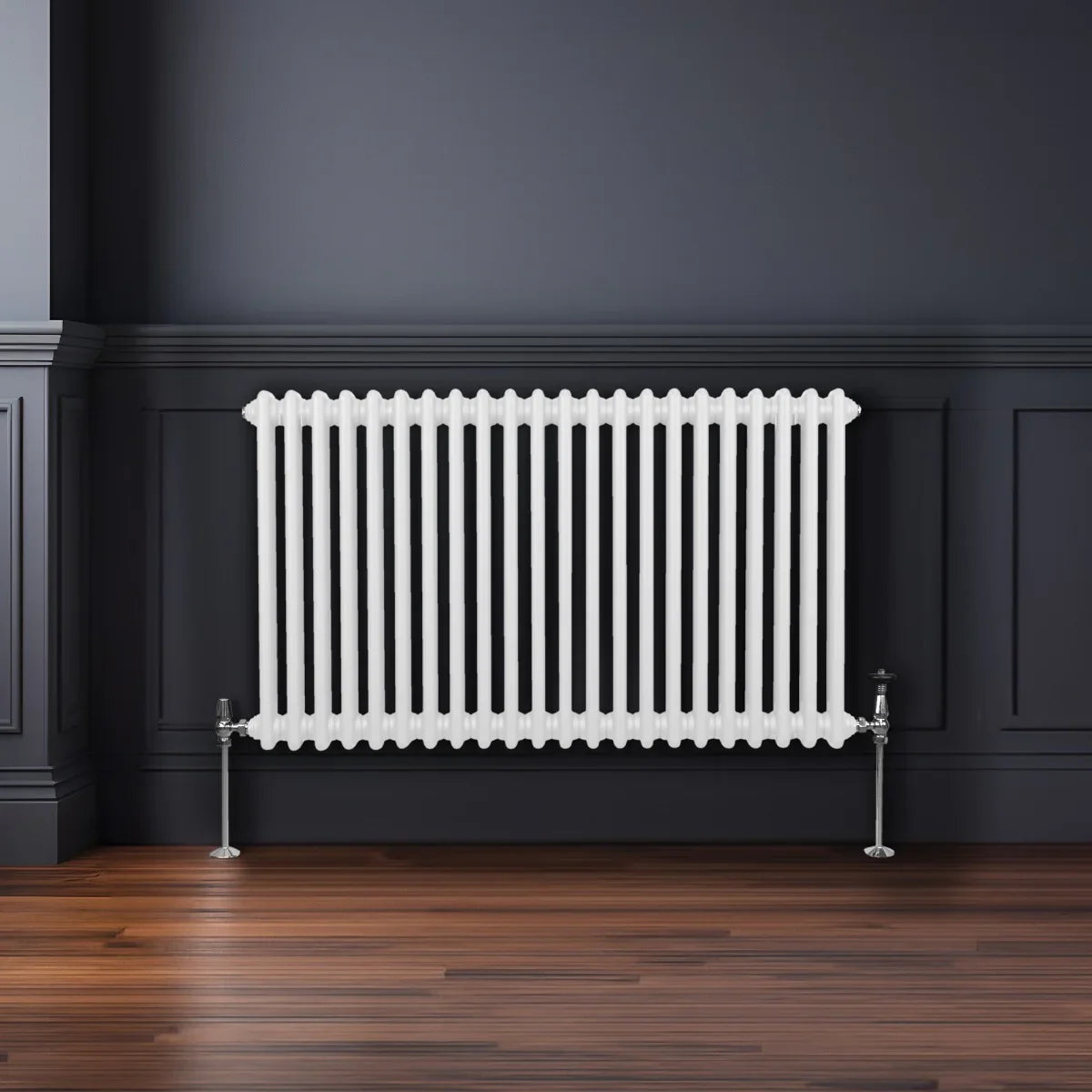 Traditional 2 column radiator in white, 600 x 1012mm, featuring a sleek design with vertical fins and polished chrome feet against a dark wall