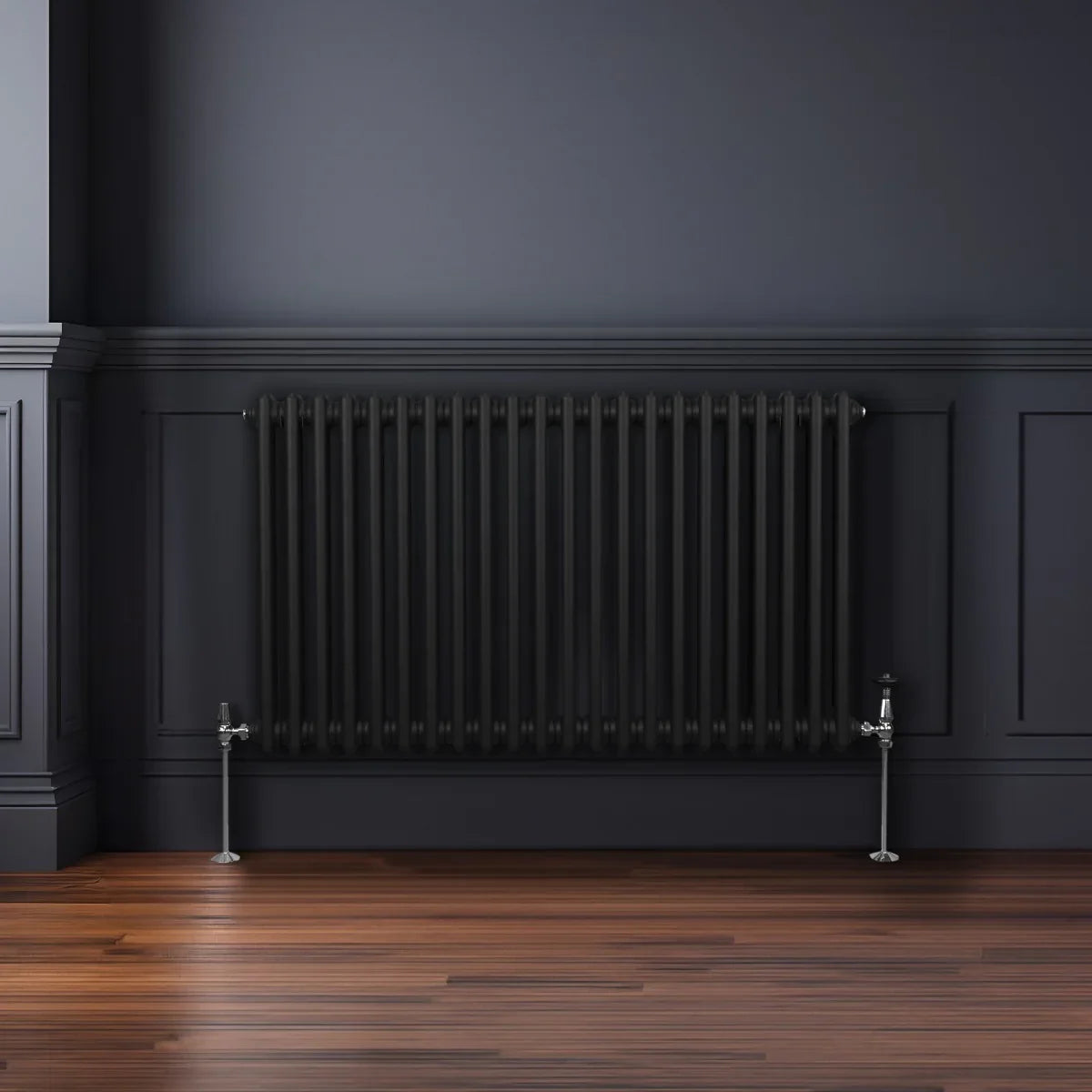 Traditional black 2 column radiator, 600 x 1012mm, featuring a sleek design with vertical bars and polished chrome valves against a dark wall
