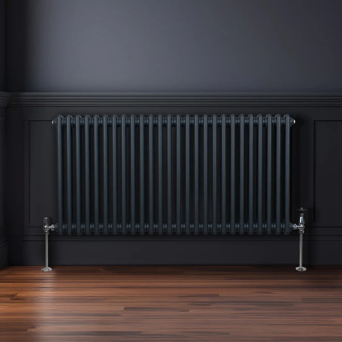 Traditional 2 column radiator in anthracite grey, featuring vertical bars, sleek design, and polished chrome valves against a dark wall