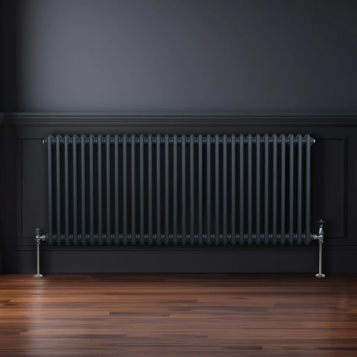 Traditional 2 column radiator in anthracite grey, featuring a sleek design with vertical bars, mounted on a dark wall above polished wooden floor