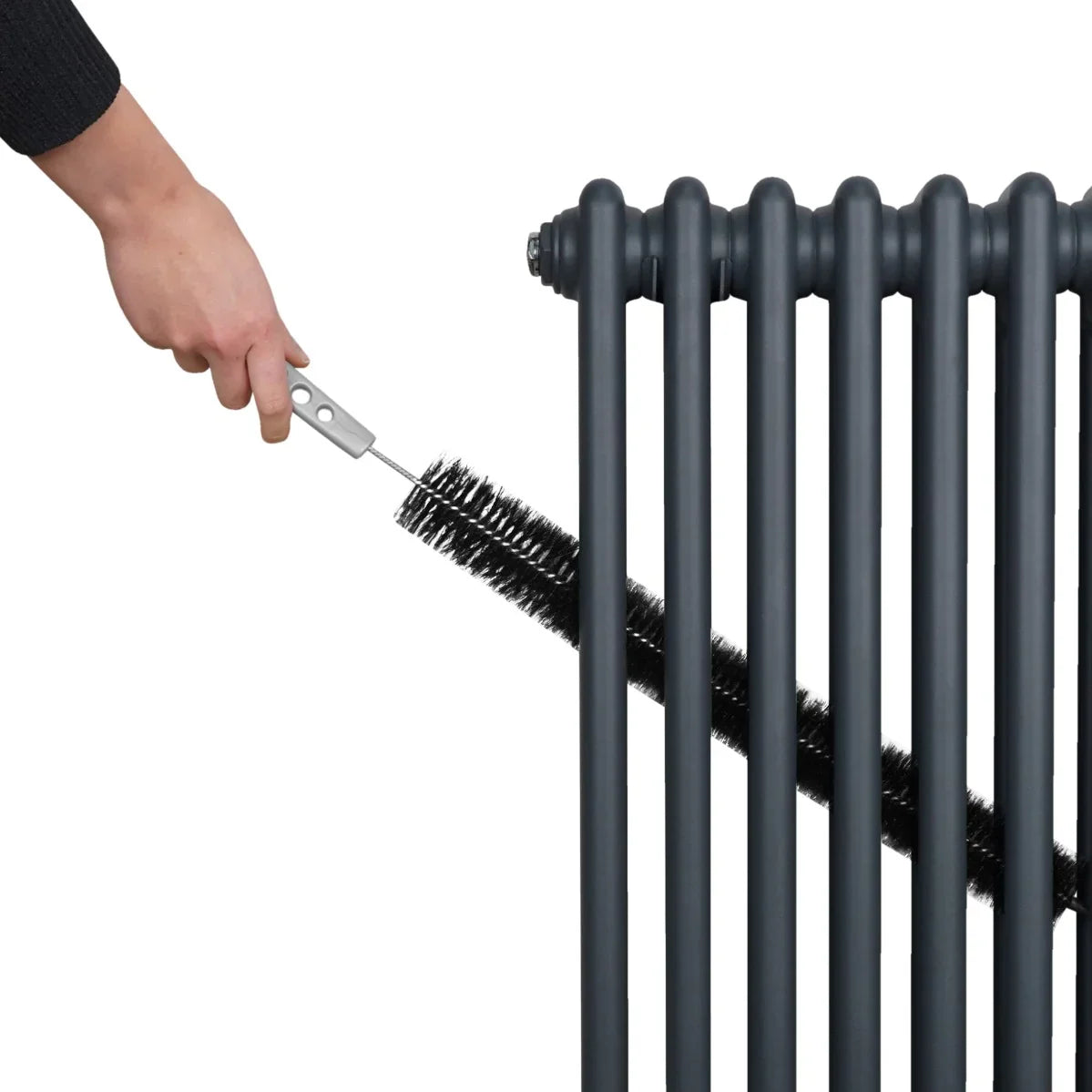 Anthracite grey traditional 2 column radiator being cleaned with a brush, showcasing its sleek design and sturdy texture