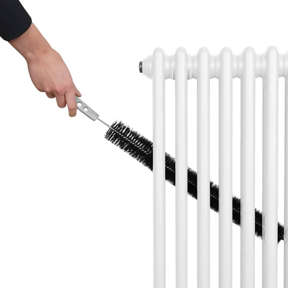 Traditional white 2 column radiator being cleaned with a brush, showcasing its sleek design and smooth finish
