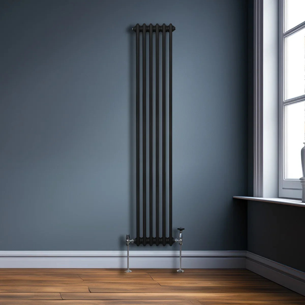 Traditional black 2 column radiator, 1800 x 292mm, featuring a sleek design and modern finish, mounted against a blue wall