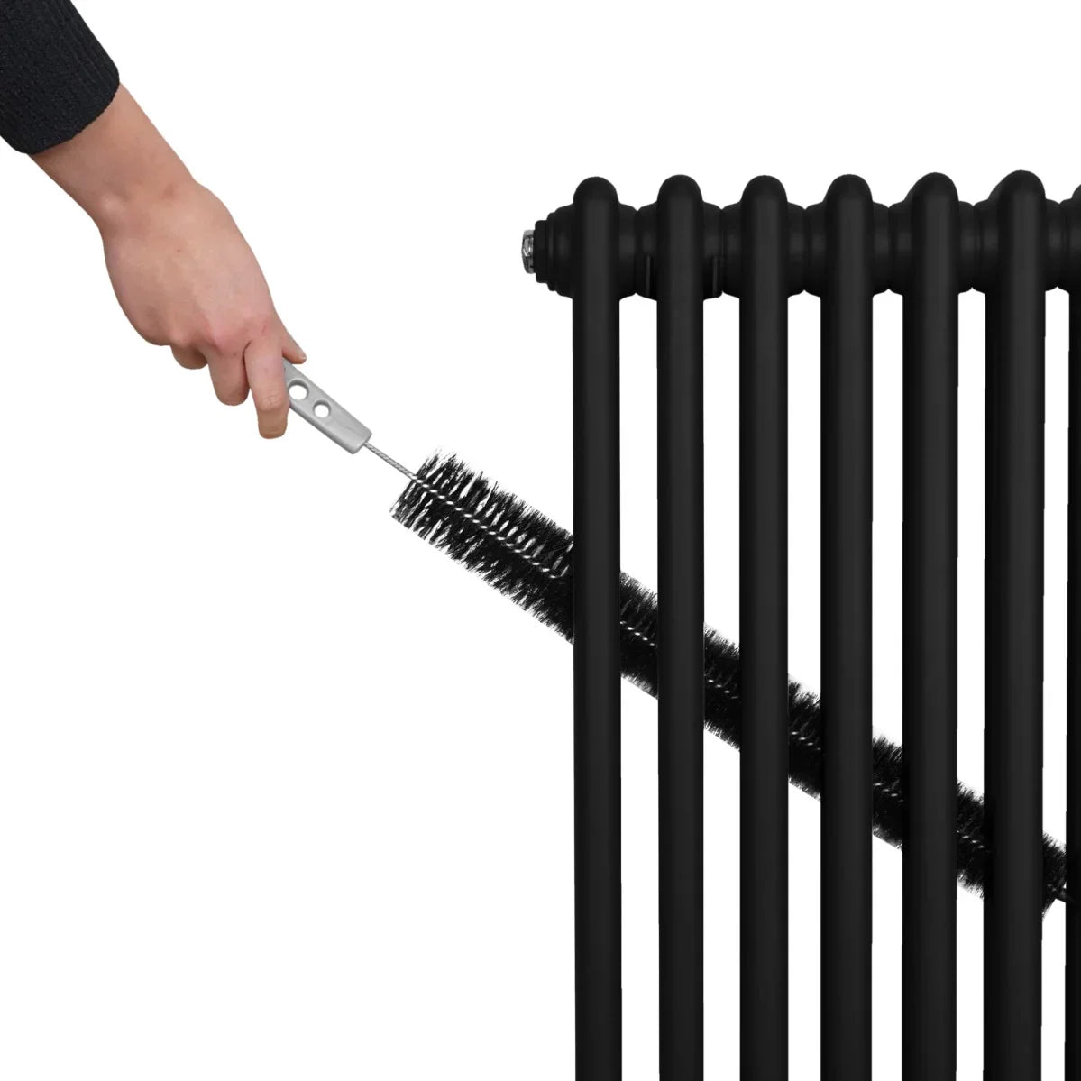 Traditional black 2 column radiator being cleaned with a brush, showcasing its sleek design and smooth texture, ideal for home heating
