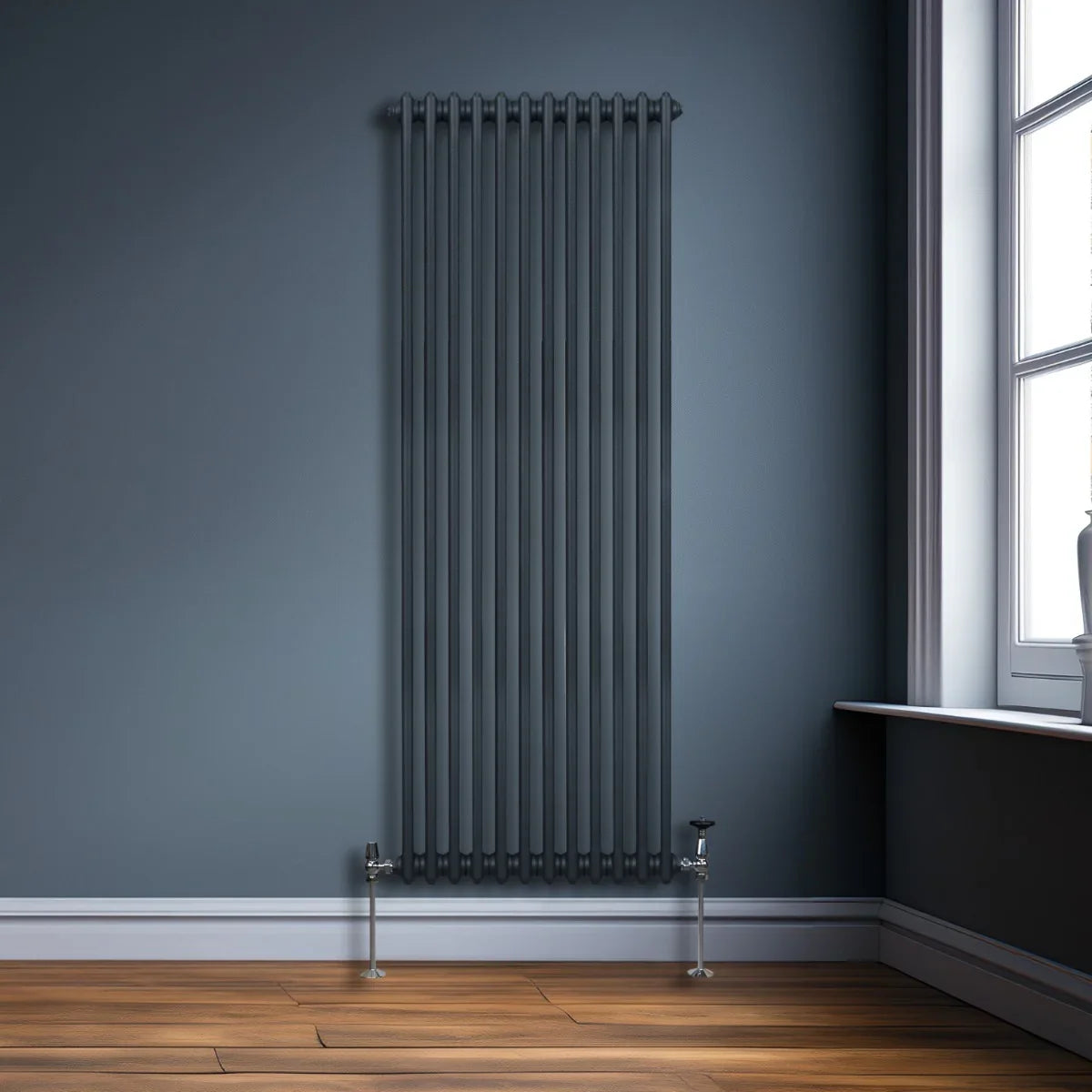 Traditional 2 column radiator in anthracite grey, 1800 x 562mm, featuring vertical tubes and a sleek, modern design against a dark wall