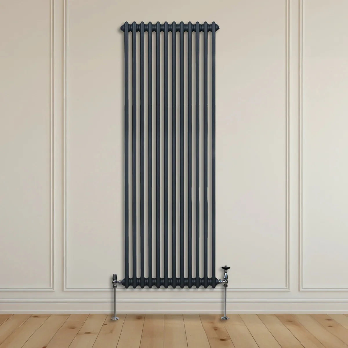 Traditional 2 column radiator in anthracite grey, 1800 x 562mm, featuring a sleek vertical design against a light wall and wooden floor