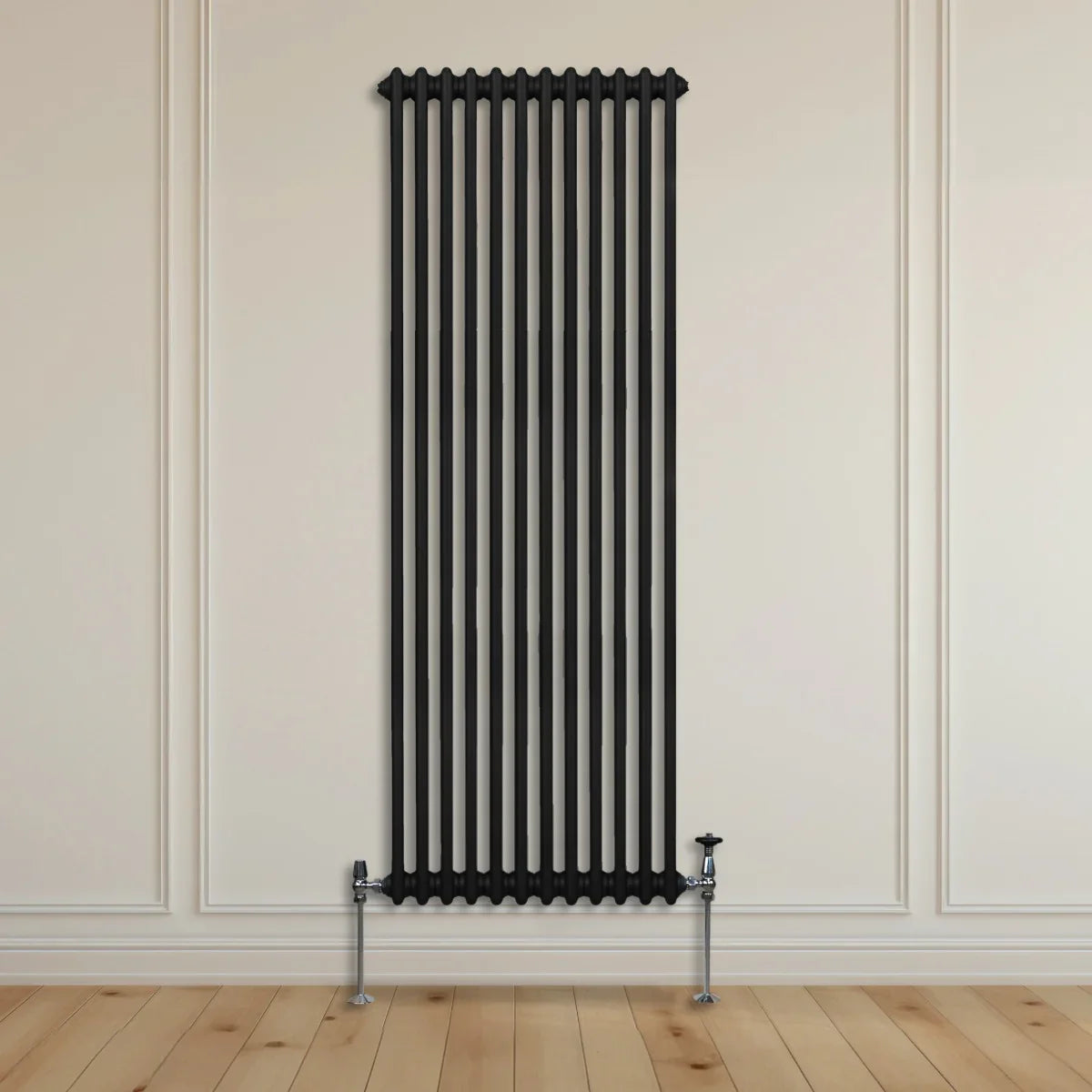 Traditional black 2 column radiator, 1800 x 562mm, featuring a sleek vertical design and polished chrome valves against a light wall