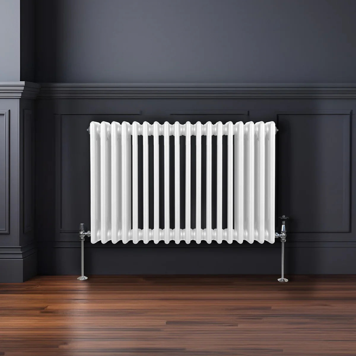 Traditional white 3 column radiator with a glossy finish, featuring a sleek, modern design against a dark wall and wooden floor