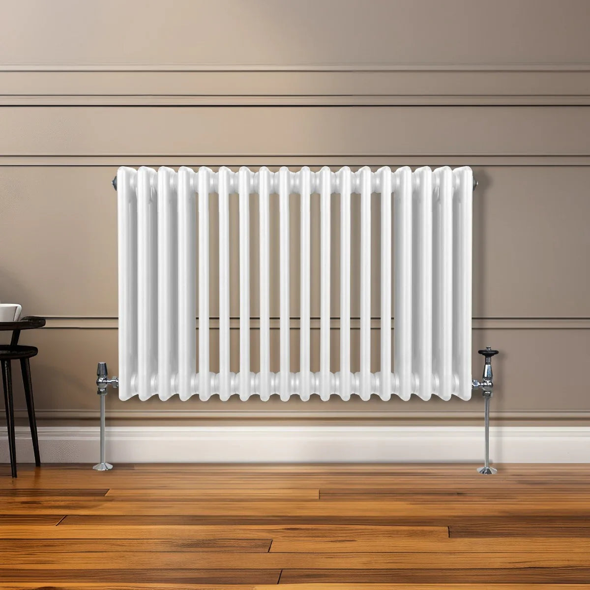 Traditional 3 column radiator in white, featuring a sleek design with vertical fins, mounted on a wooden floor against a neutral wall