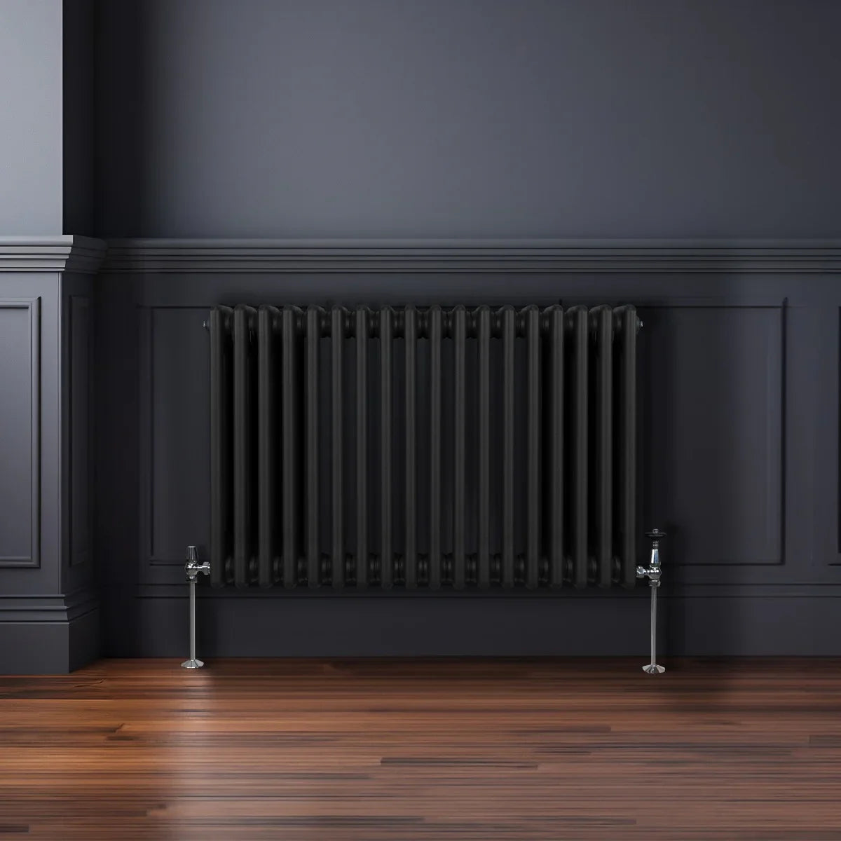 Traditional black 3 column radiator, 600 x 832mm, featuring a sleek design against a dark wall and polished wooden floor