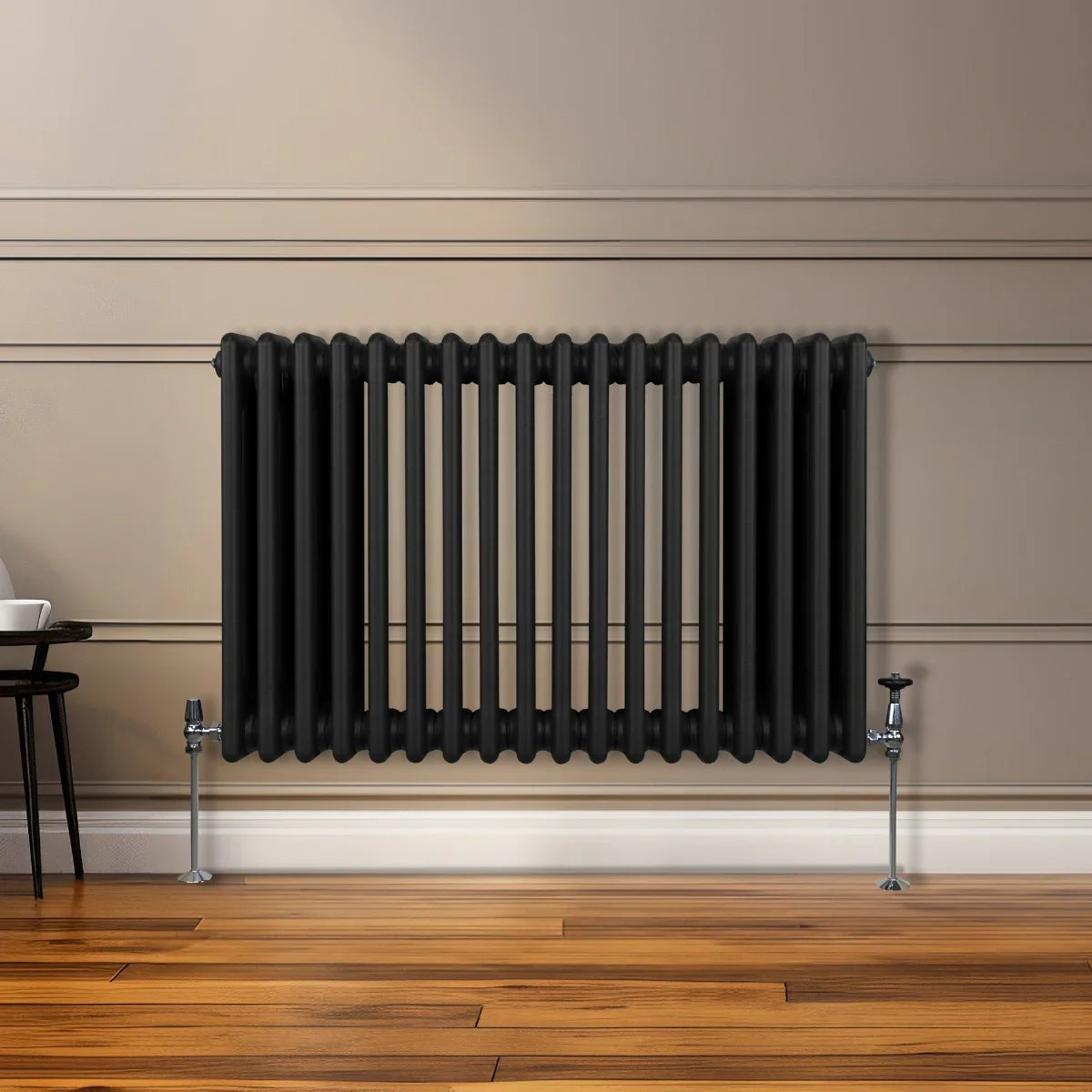 Traditional black 3 column radiator, 600 x 832mm, featuring a sleek design with smooth, rounded edges, mounted on a wooden floor