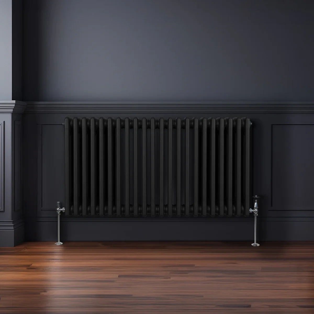 Traditional black 3 column radiator, 600 x 1012mm, featuring a sleek design with vertical lines, mounted on a dark wall above wooden flooring